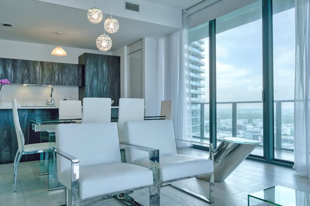 Wraparound terrace of Residence 2607 overlooking Biscayne Bay and the Miami skyline