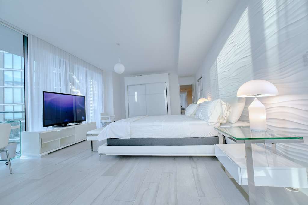 Oversized primary suite with wide bay views